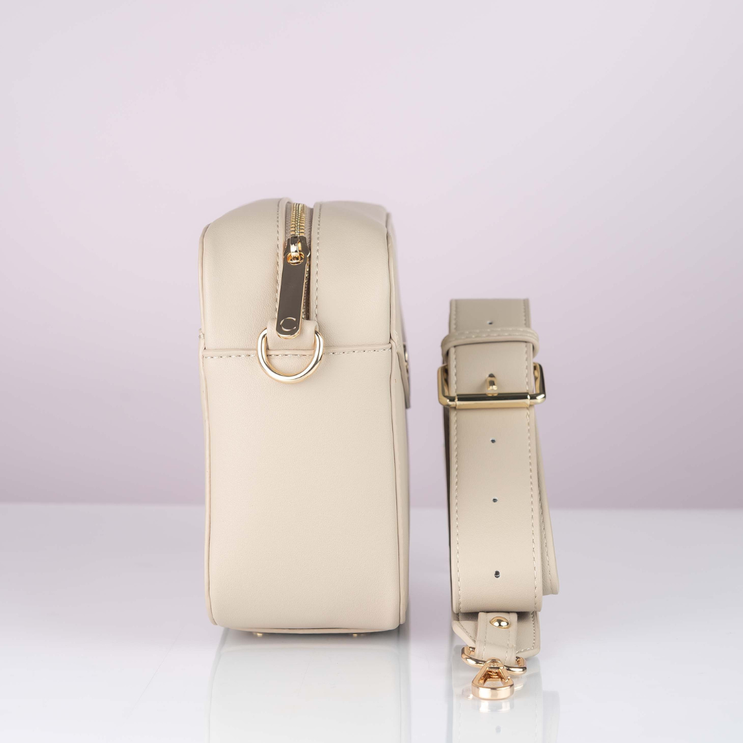 Structured cross body bag in Fawn, signature clasp.