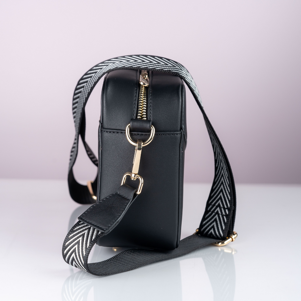Spacious and durable Black Carter cross body bag.
