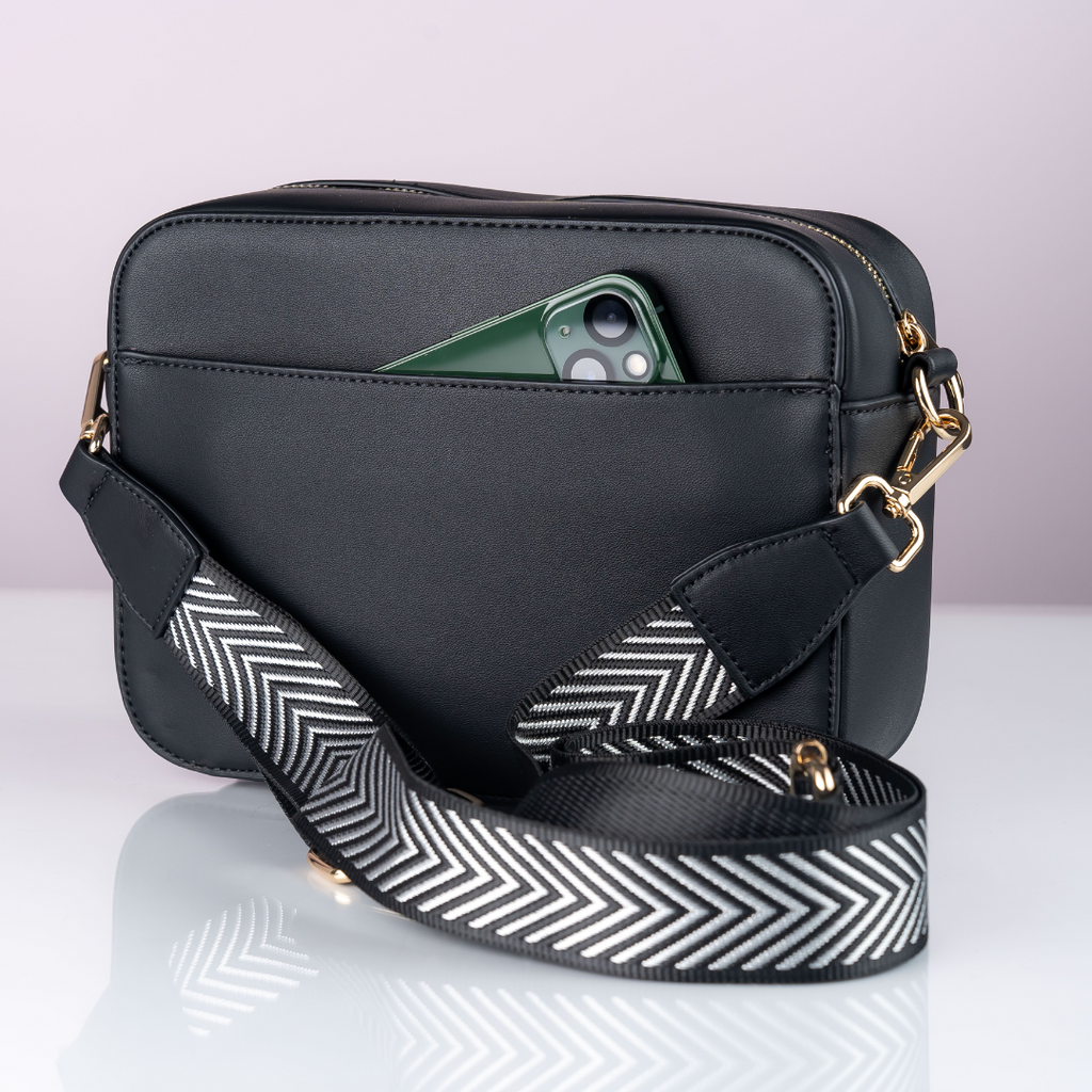 Signature Carter cross body bag with hidden pockets.